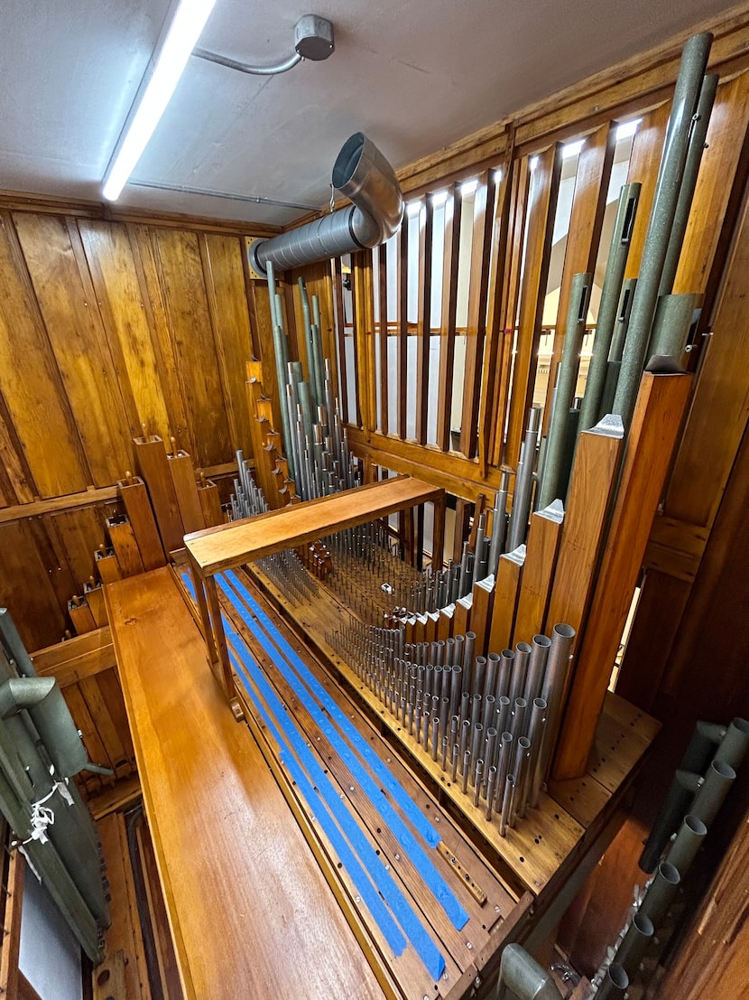 Behind shiny facade pipes, speaking pipes and mechanisms of the 1927 E.M. Skinner organ...