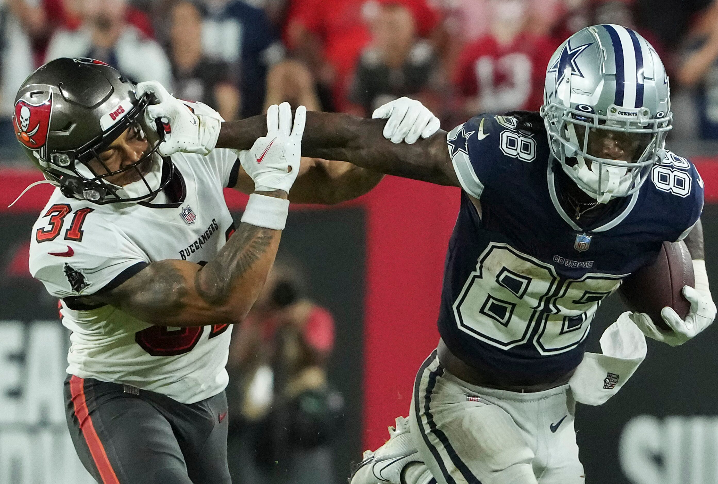 Dallas Cowboys wide receiver CeeDee Lamb (88) pushes past Tampa Bay Buccaneers safety...