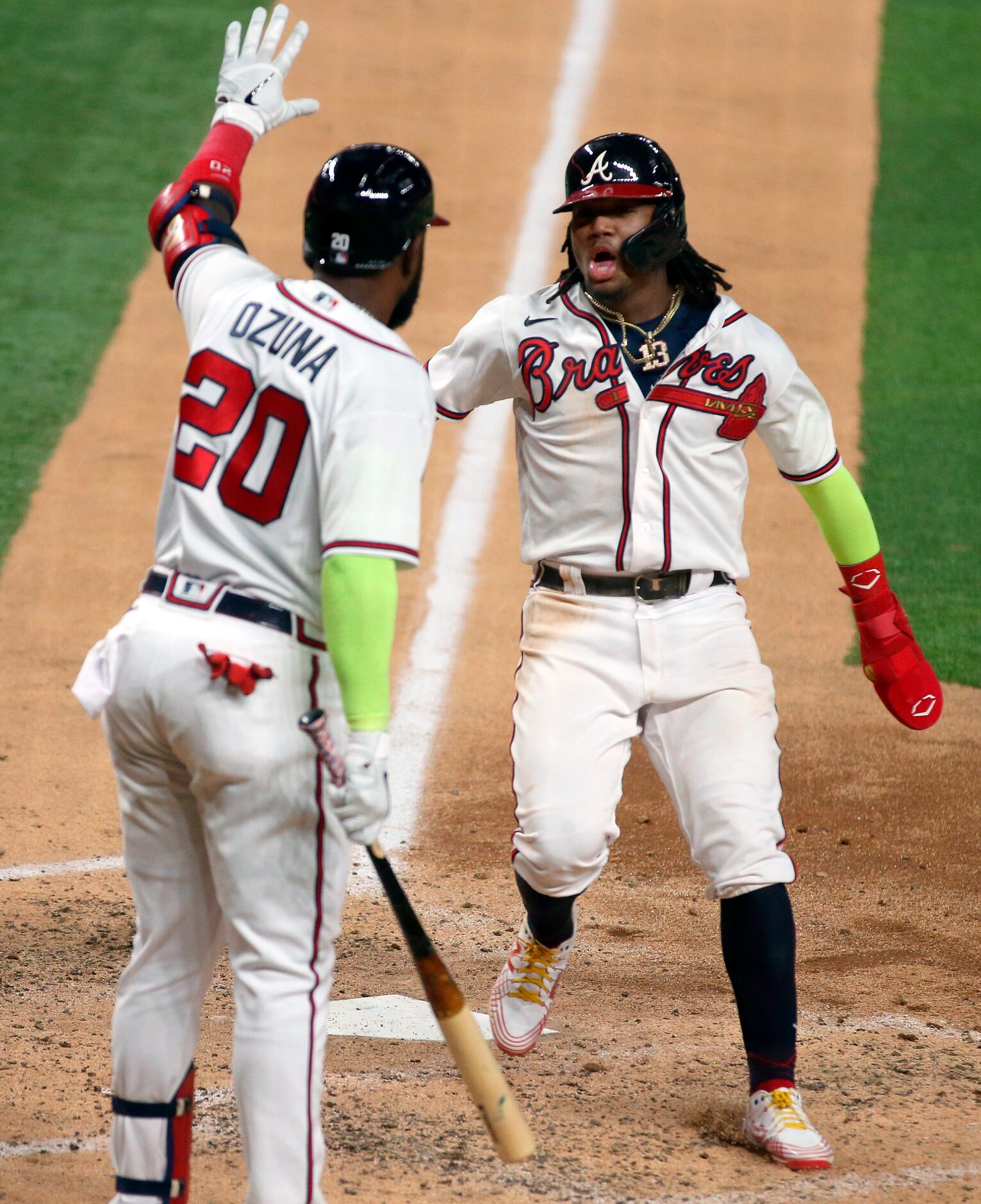 Atlanta Braves right fielder Ronald Acuna Jr. (13) is congratulated on his sixth inning run...