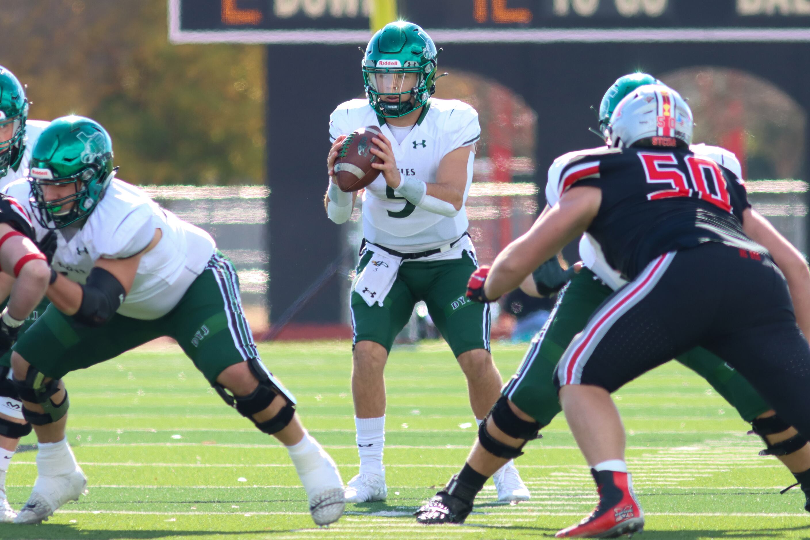 Prosper quarterback Jackson Berry (5) receives the snap during the first half against Flower...