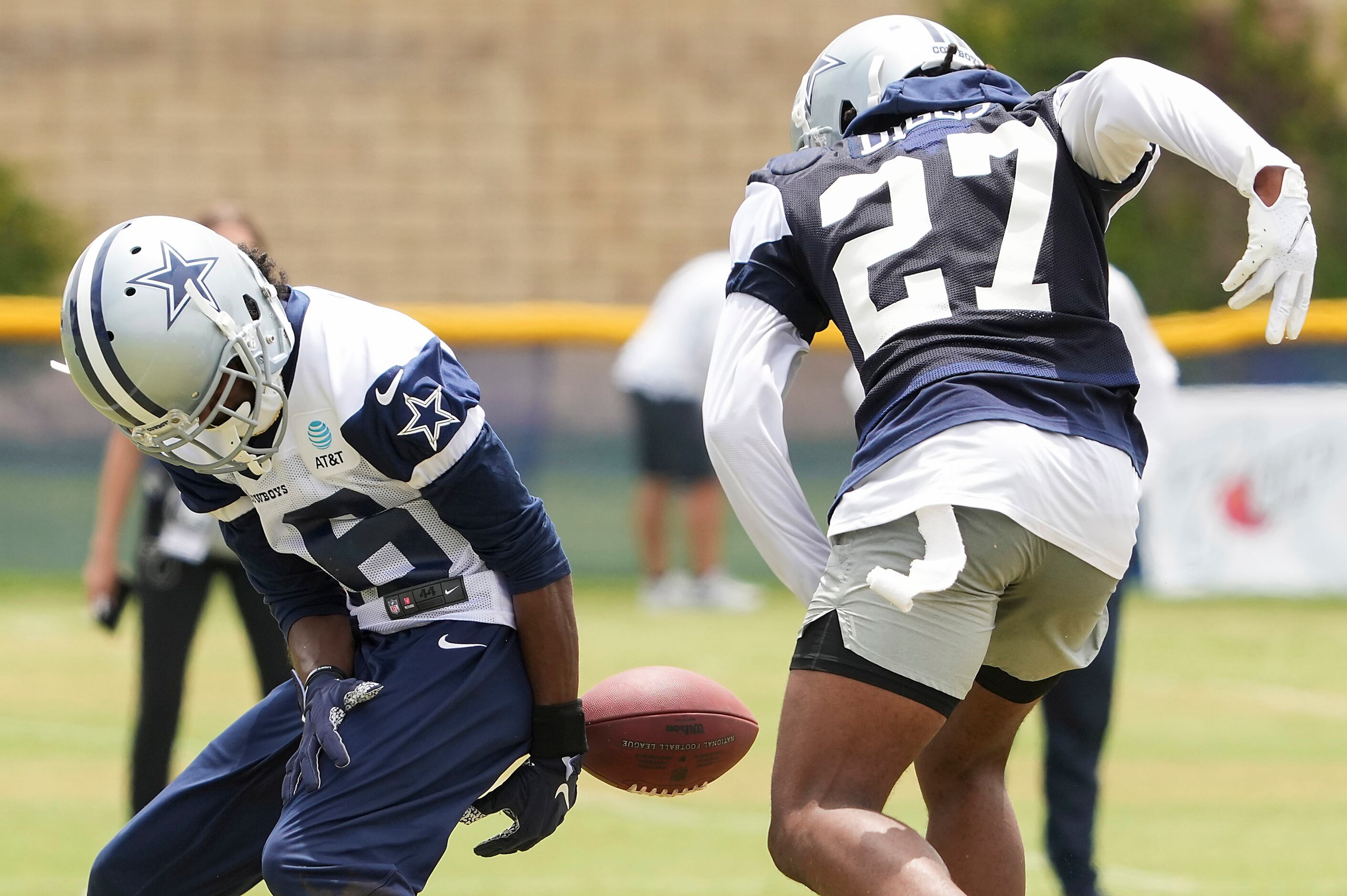 Dallas Cowboys cornerback Trevon Diggs (27) forces a fumble by wide receiver Reggie Davis...