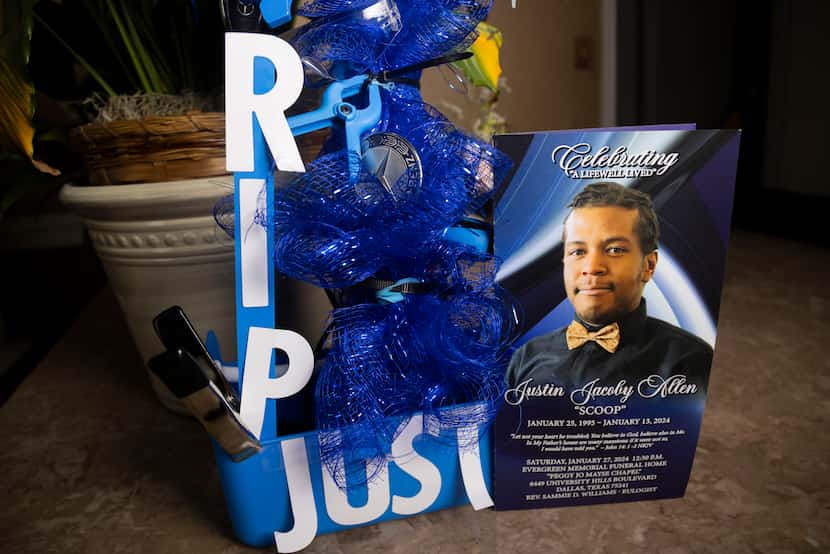 A memorial for Justin Allen decorated in mechanic parts sits on display on the dining table...