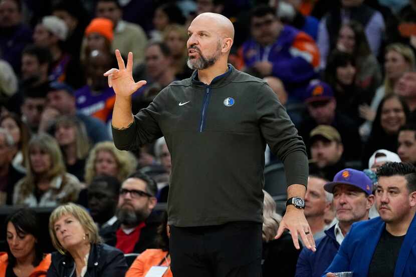 Dallas Mavericks head coach Jason Kidd makes a call during the second half of an NBA...