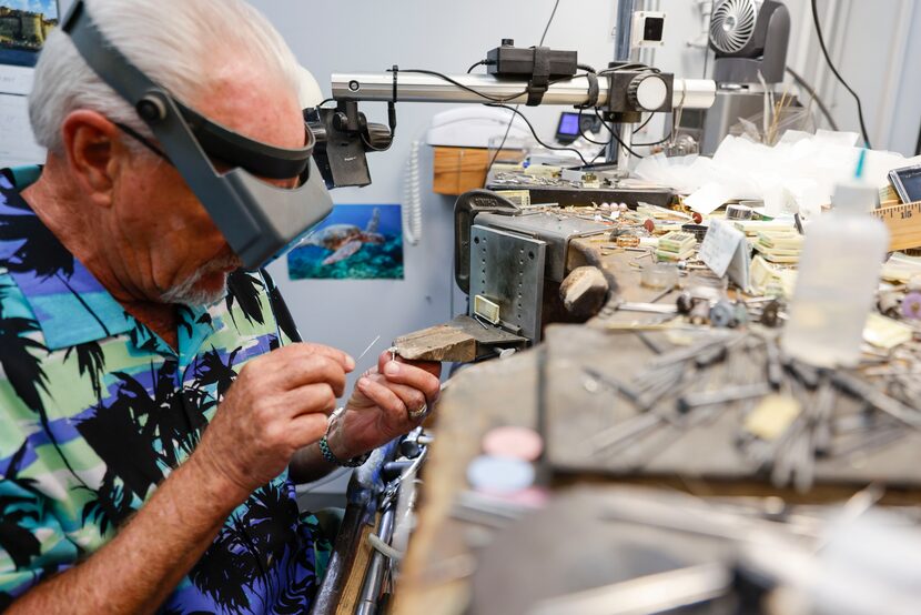 Ron Coker works on a 4-carat diamond ring at Bachendorf's headquarter in Dallas. 