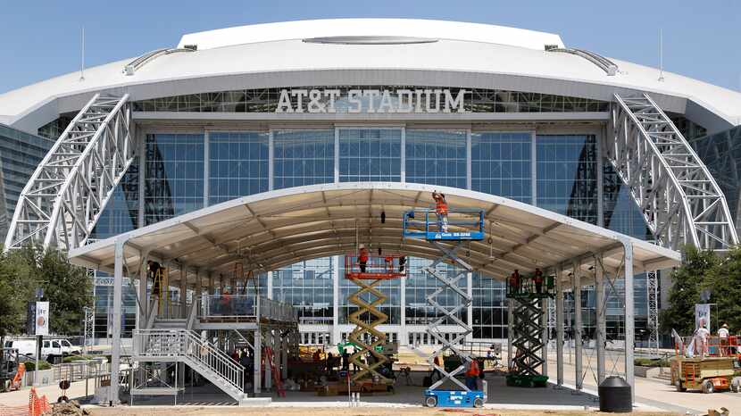 Construction workers finished up on the new Corral at AT&T Stadium in Arlington on Aug. 13,...