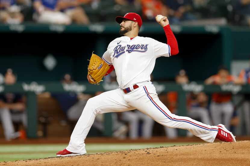Texas Rangers starting pitcher Martin Perez (54) throws a pitch during the fourth inning of...