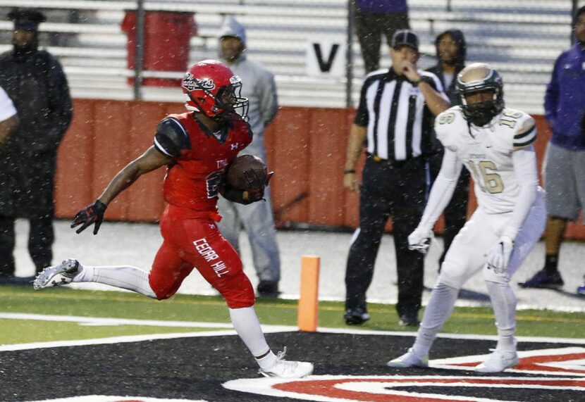 Cedar Hill's Jameel Moore (5) rushes into the end zone for a touchdown in a game against...