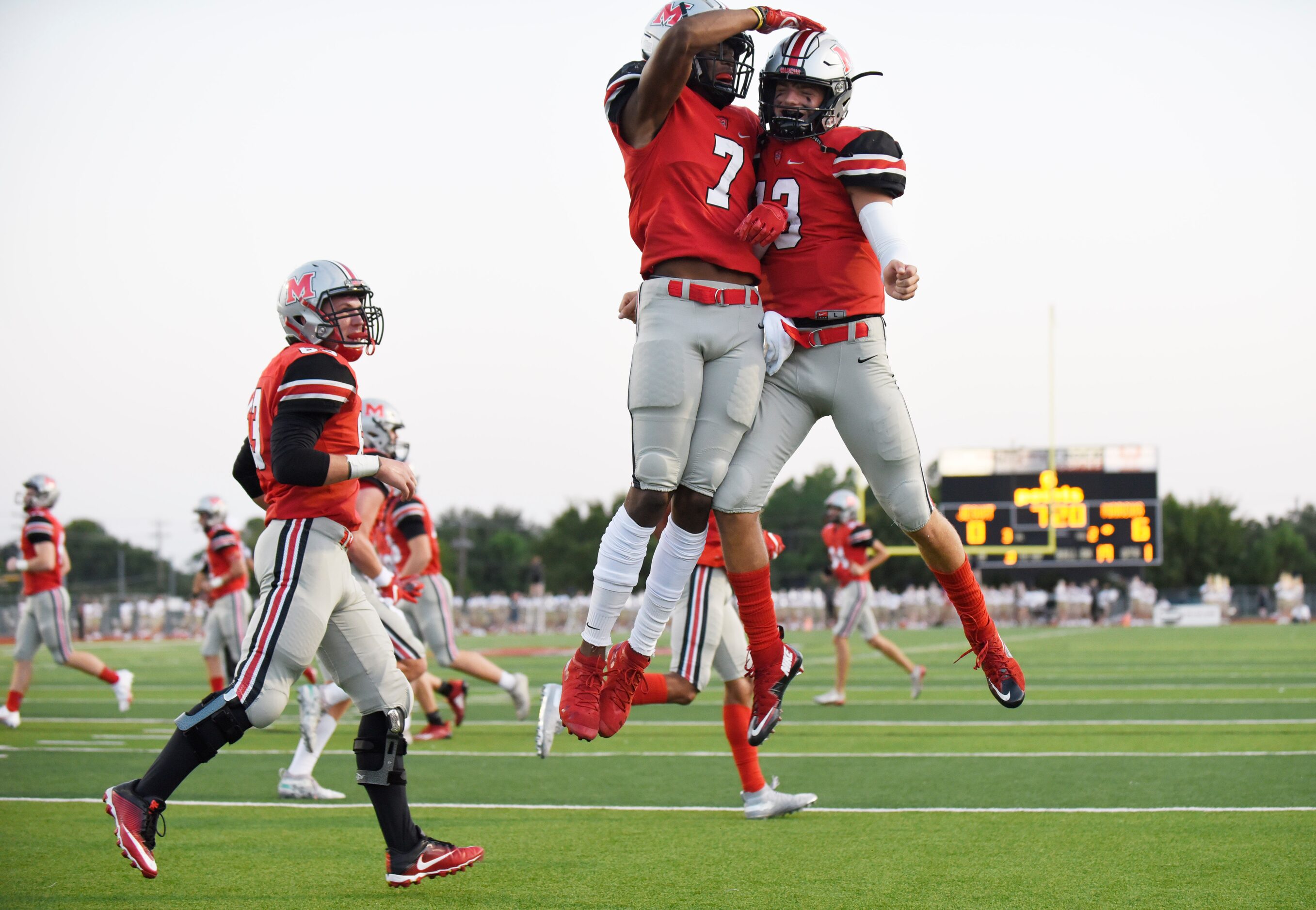 Flower Mound Marcus senior wide receiver J. Michael Sturdivant (7) celebrates with senior...