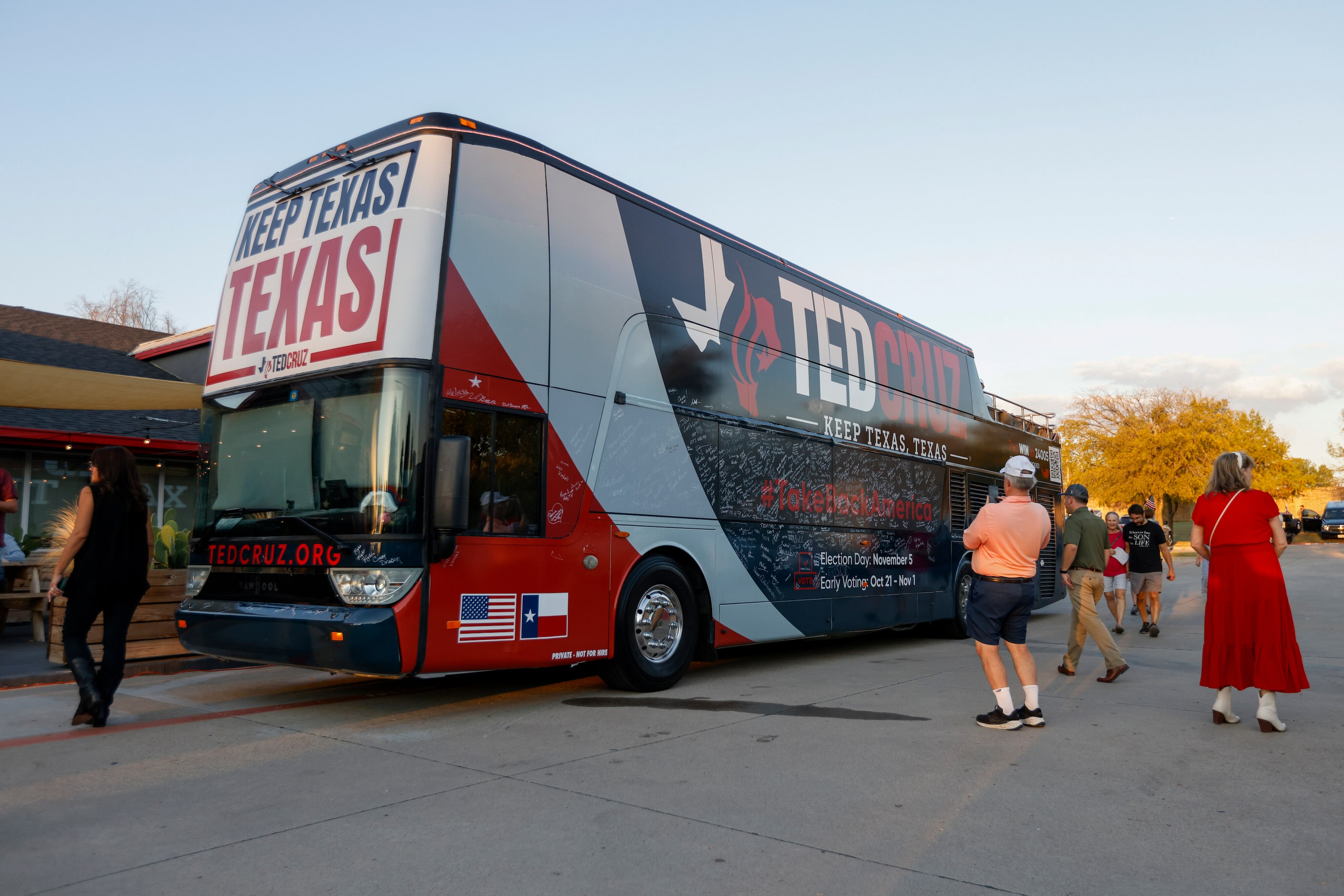 People take photos outside of Senator Ted Cruz’s (R-Texas) campaign bus during a rally at...