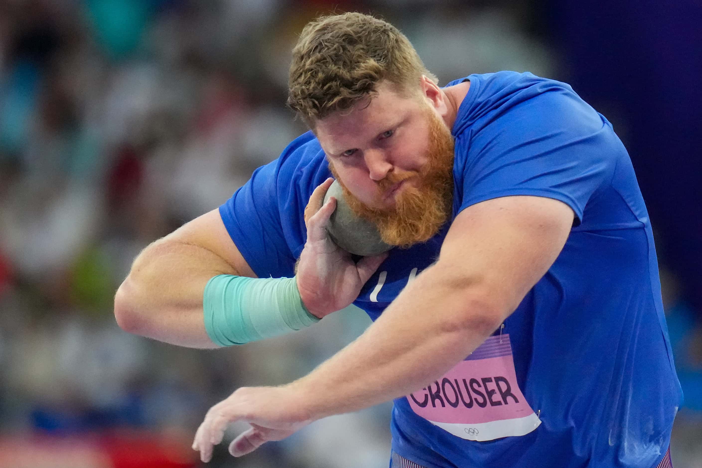 Ryan Crouser competes in shot put qualifying at the 2024 Summer Olympics on Friday, Aug. 2,...