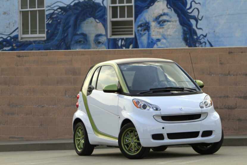 The Smart Fortwo can travel 63 to 98 miles per charge using its 30-kilowatt permanent magnet...