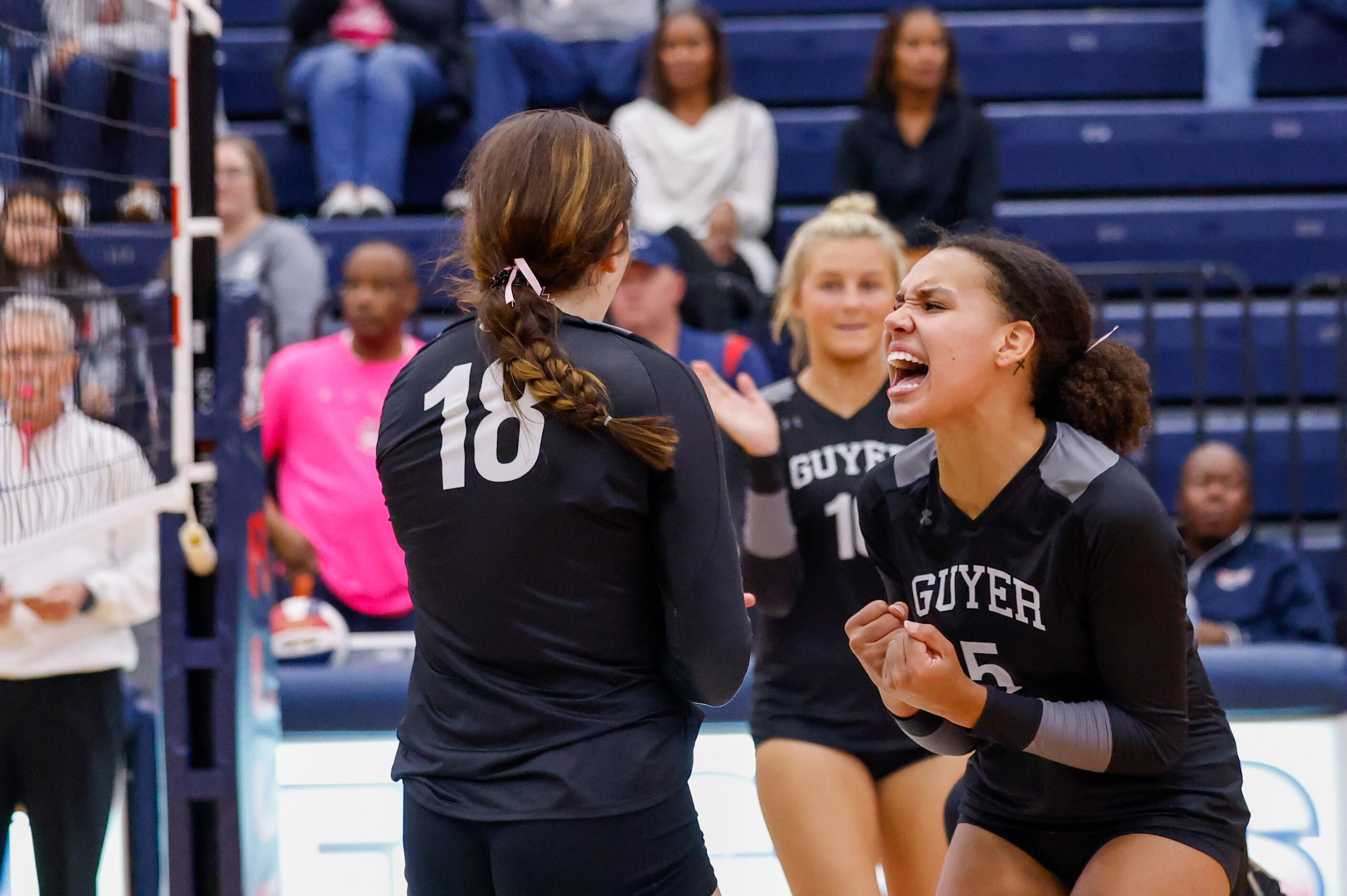 Denton Guyer senior Kyndal Stowers (5) celebrates senior Erika Gustafson’s (18) point...