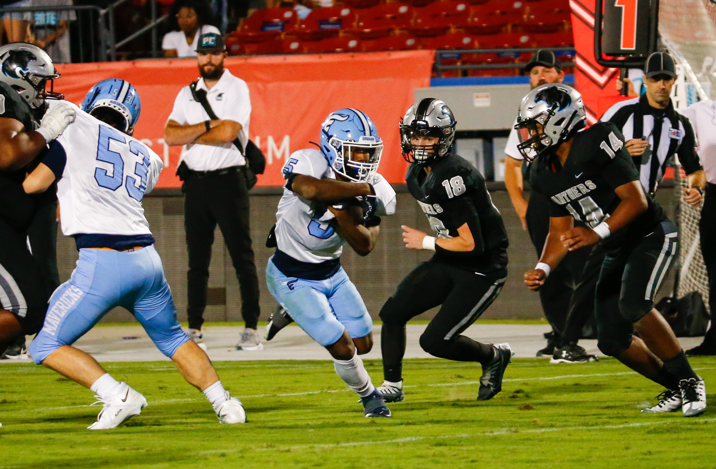 Emerson Mavericks running back Ishaqq Bills (5) dodges Panther Creek Panthers defenders...