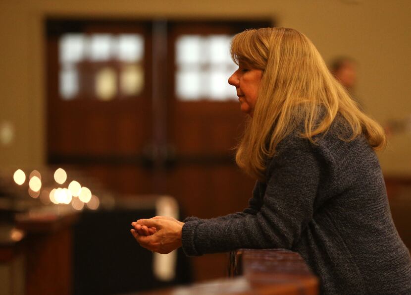 The Rev. Laura Echols-Richter prays in the sanctuary at Grace Avenue United Methodist Church...