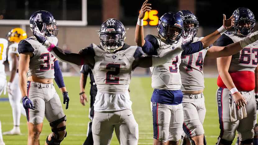 Allen running back Kayvion Sibley (2) and quarterback Mike Hawkins (3) celebrate as the...