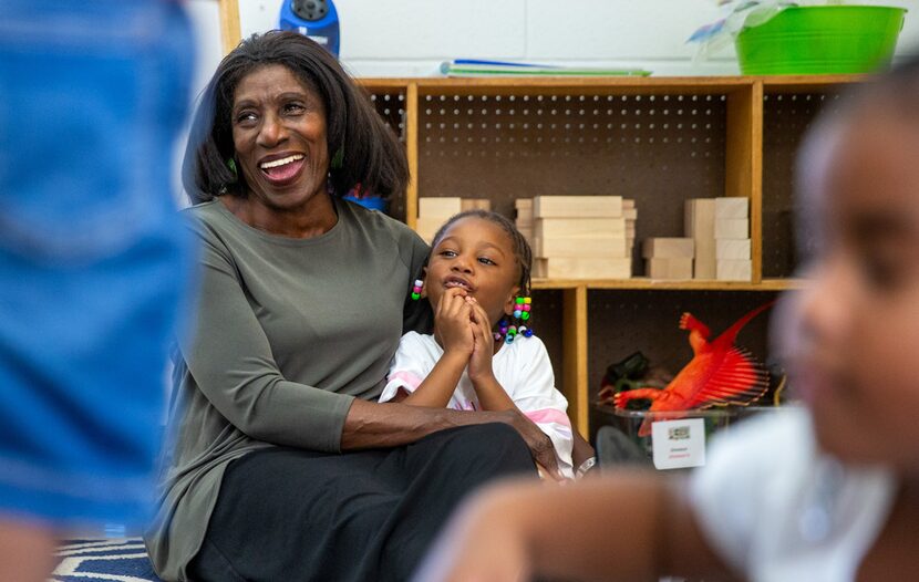 Bobbie Blair returns a hug from 3-year-old ArNiya Vatin at the Martin Luther King Jr. Center.