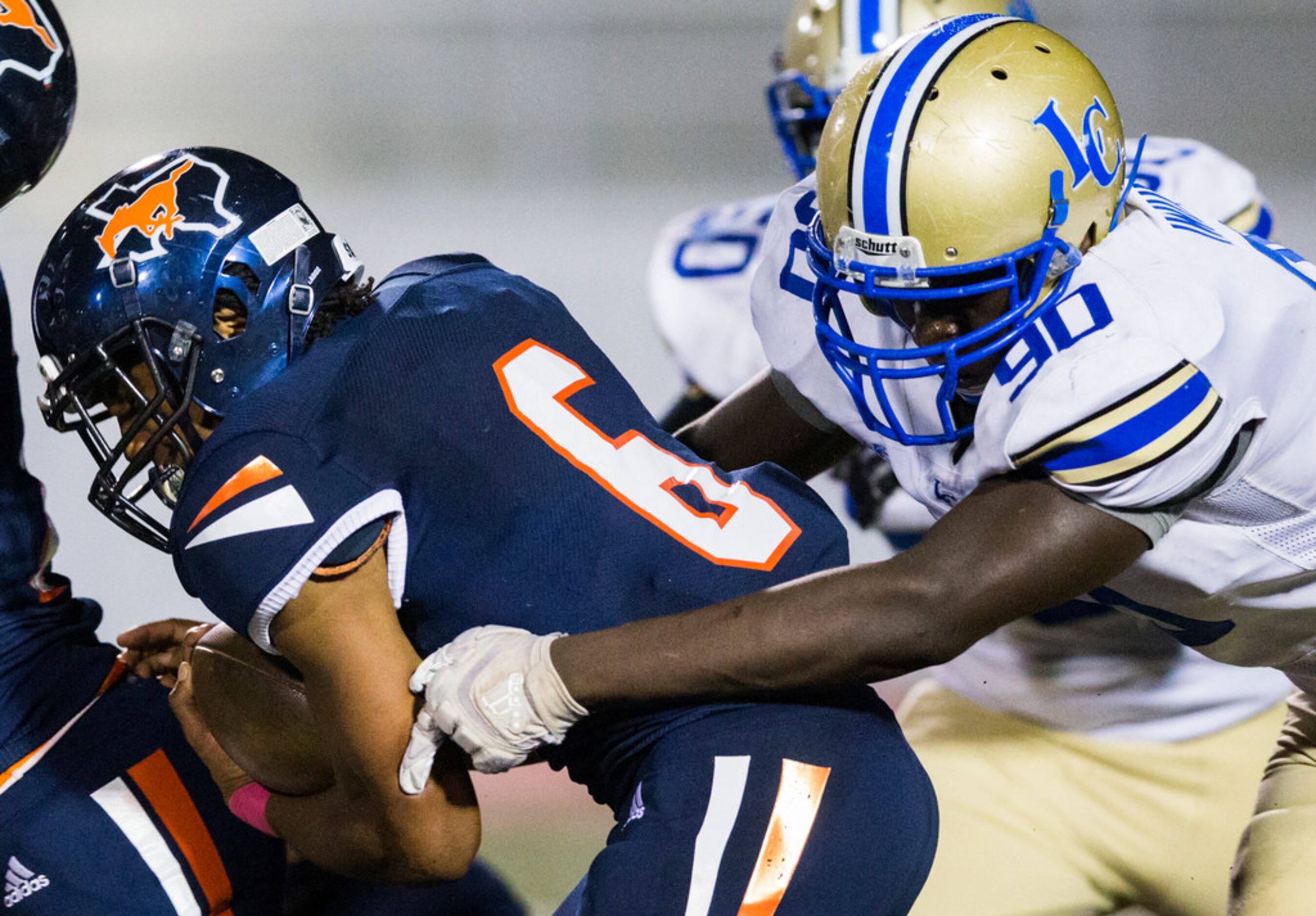 Sachse running back Shon Coleman (6) is tackled by Garland Lakeview defensive lineman...