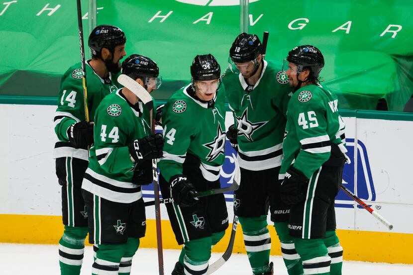 Dallas Stars players celebrate right wing Denis Gurianov (34) goal in the second period...