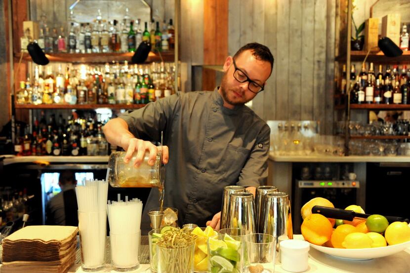 Bartender Jules Pagan makes a drink at the new Mexican-French hybrid restaurant Madrina.