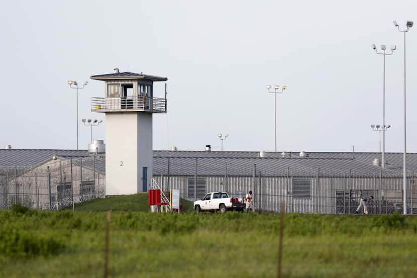 An inmate works outdoors on the "hoe quad" outside a Texas prison unit in Huntsville on June...