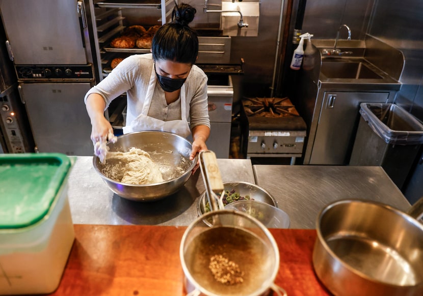 New Lucia bread maker Karen Montero bakes a bread in the kitchen.