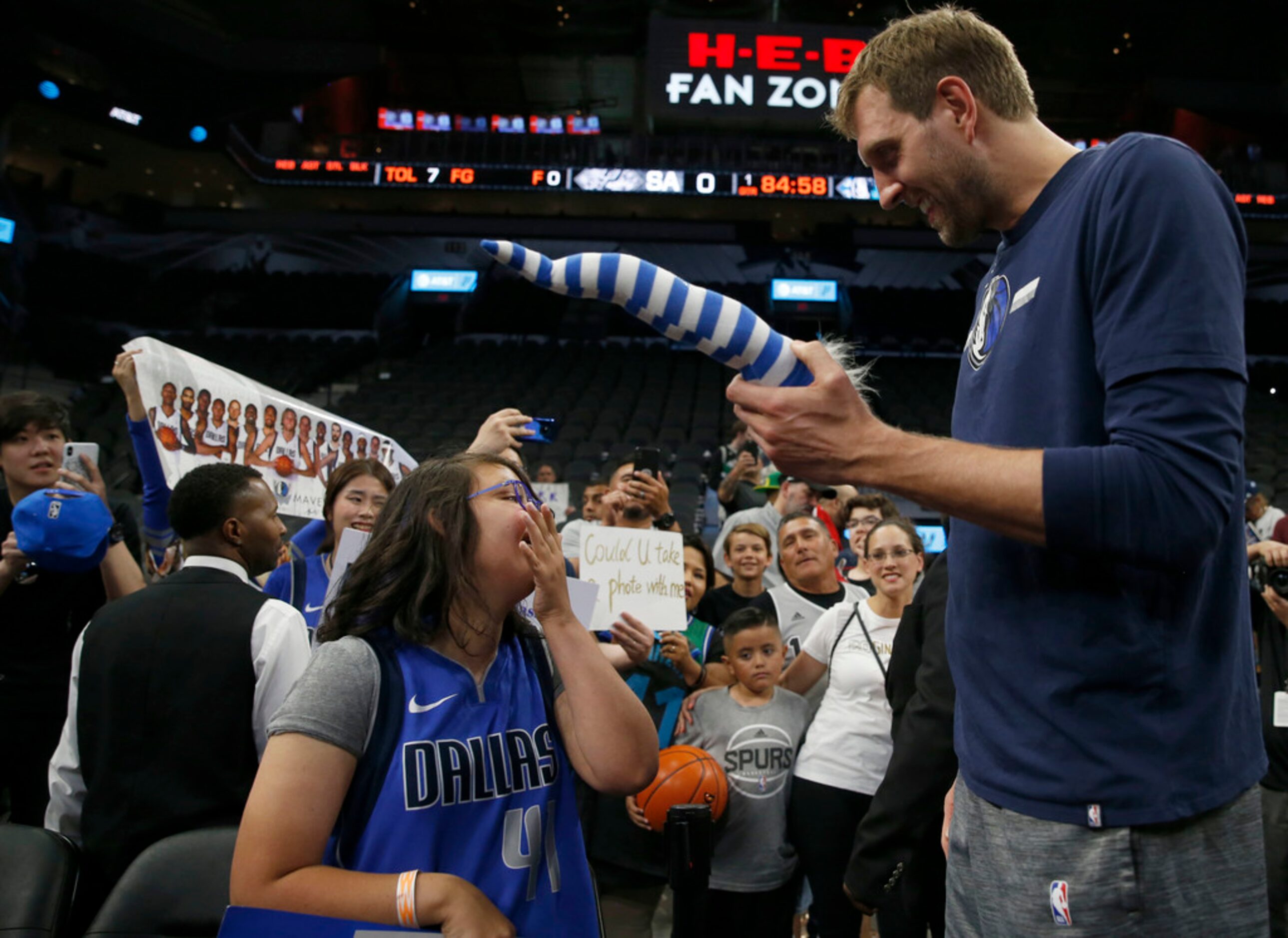 Anna Smedley, 16 of San Antonio, cries as she talks with Dallas Mavericks forward Dirk...