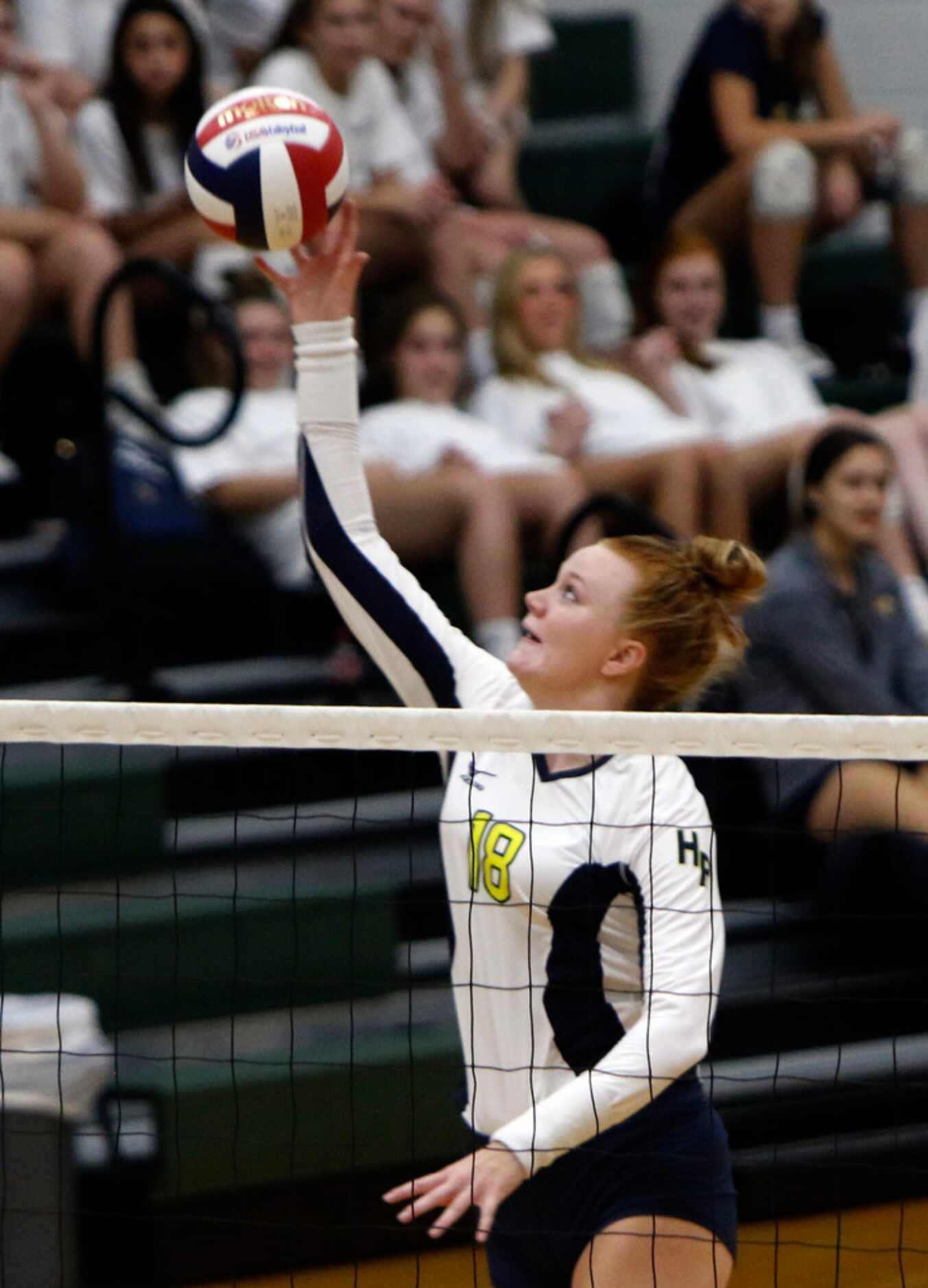 Highland Park outside hitter Kendyl Reaugh (18) sends a shot during the second game of their...