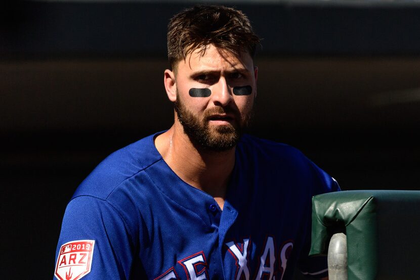 MESA, ARIZONA - MARCH 05: Joey Gallo #13 of the Texas Rangers looks on during the spring...