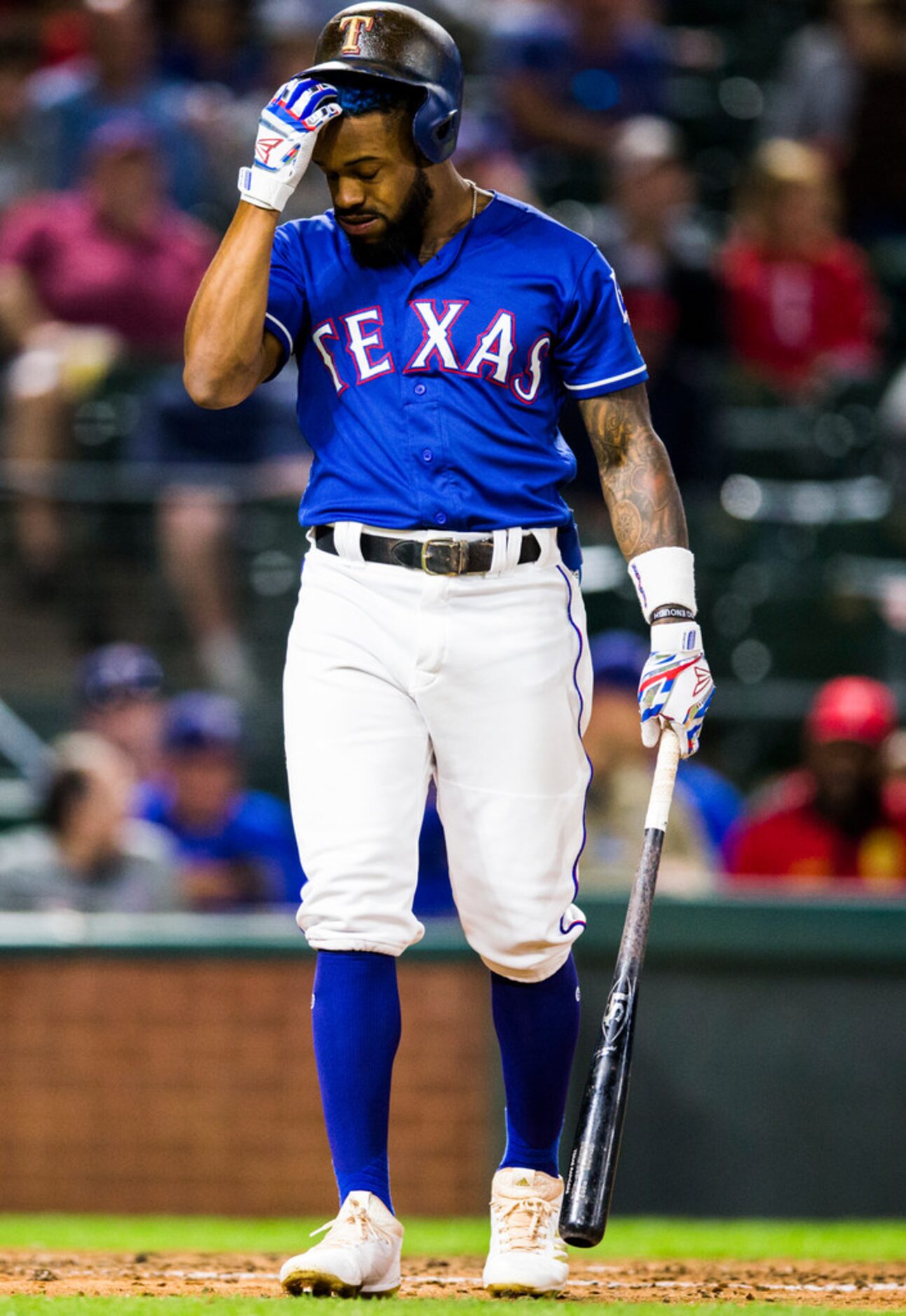 Texas Rangers center fielder Delino DeShields (3) reacts after striking out during the fifth...