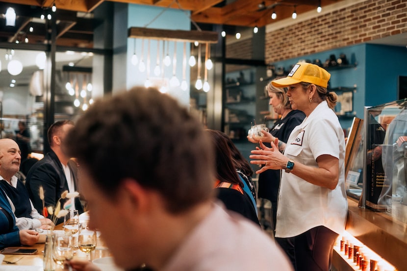 Chef Jennie Kelley talks to diners at a recent Fond A.D. dinner