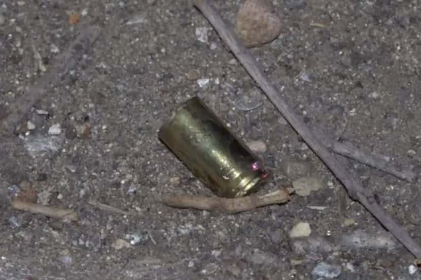 A shell casing lies on the ground on Gannon Lane in Red Bird after a man was killed in a...