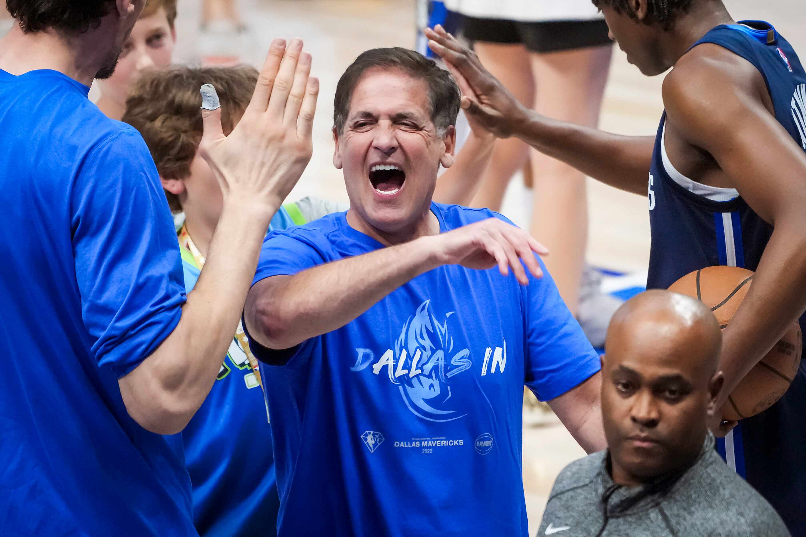 Dallas Mavericks owner Mark Cuban celebrates with center Boban Marjanovic and guard Frank...