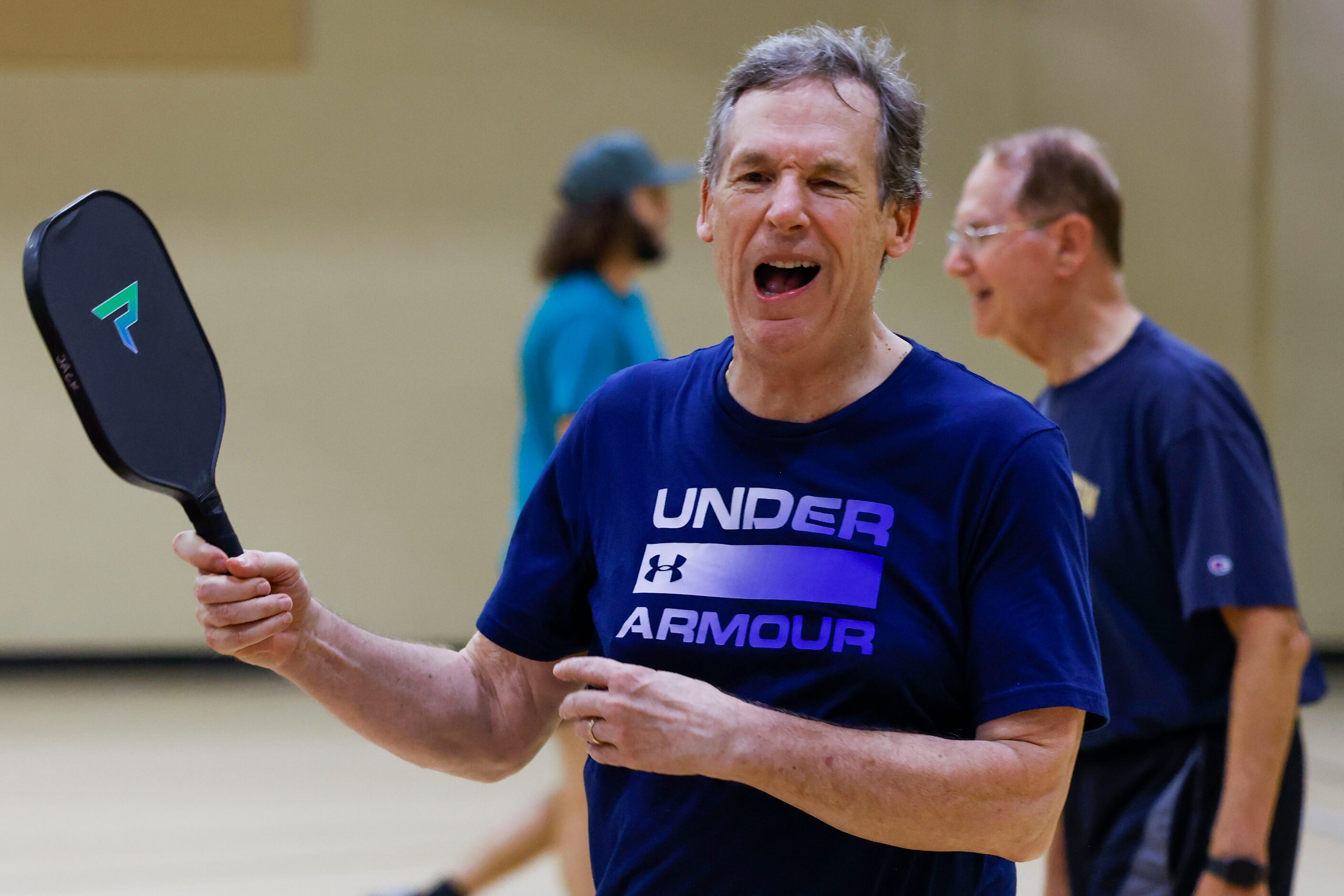 Plano resident Jack Jerreenoe reacts after missing to hit during a pickle ball game on...