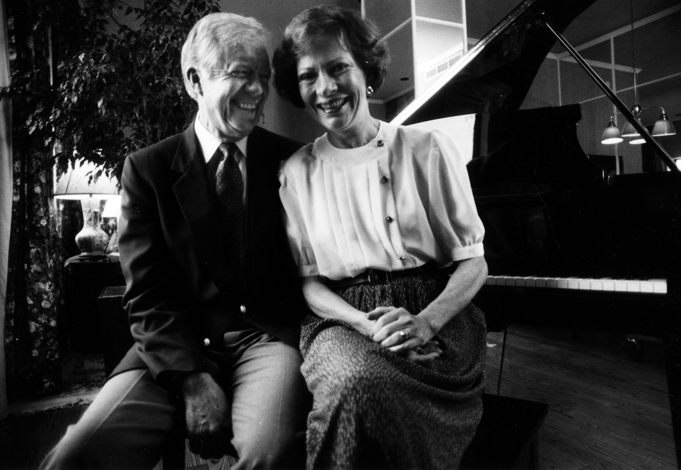 Former President Jimmy Carter and his wife Rosalynn share a little moment at the end of an...