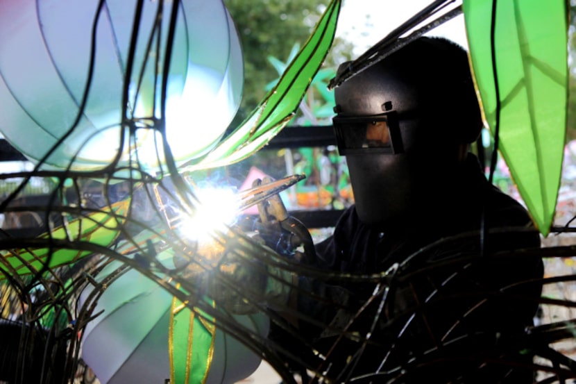 Jiayong Yang welds lanterns in preparation for the Chinese Lantern Festival at Fair Park....