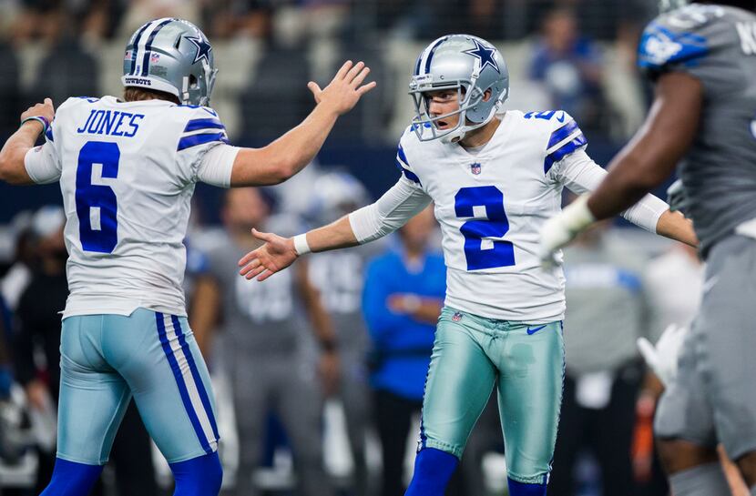 Dallas Cowboys kicker Brett Maher (2) celebrates with punter Chris Jones (6) after kicking...