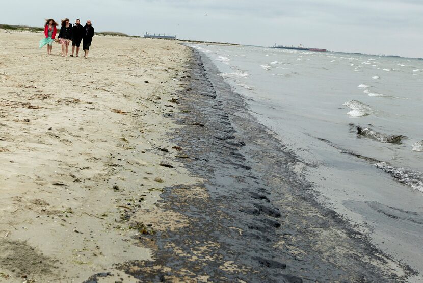 From left, Madison Dwyer, Morgan Dwyer, Seth Thomason and John A. Lowe walk along East Beach...