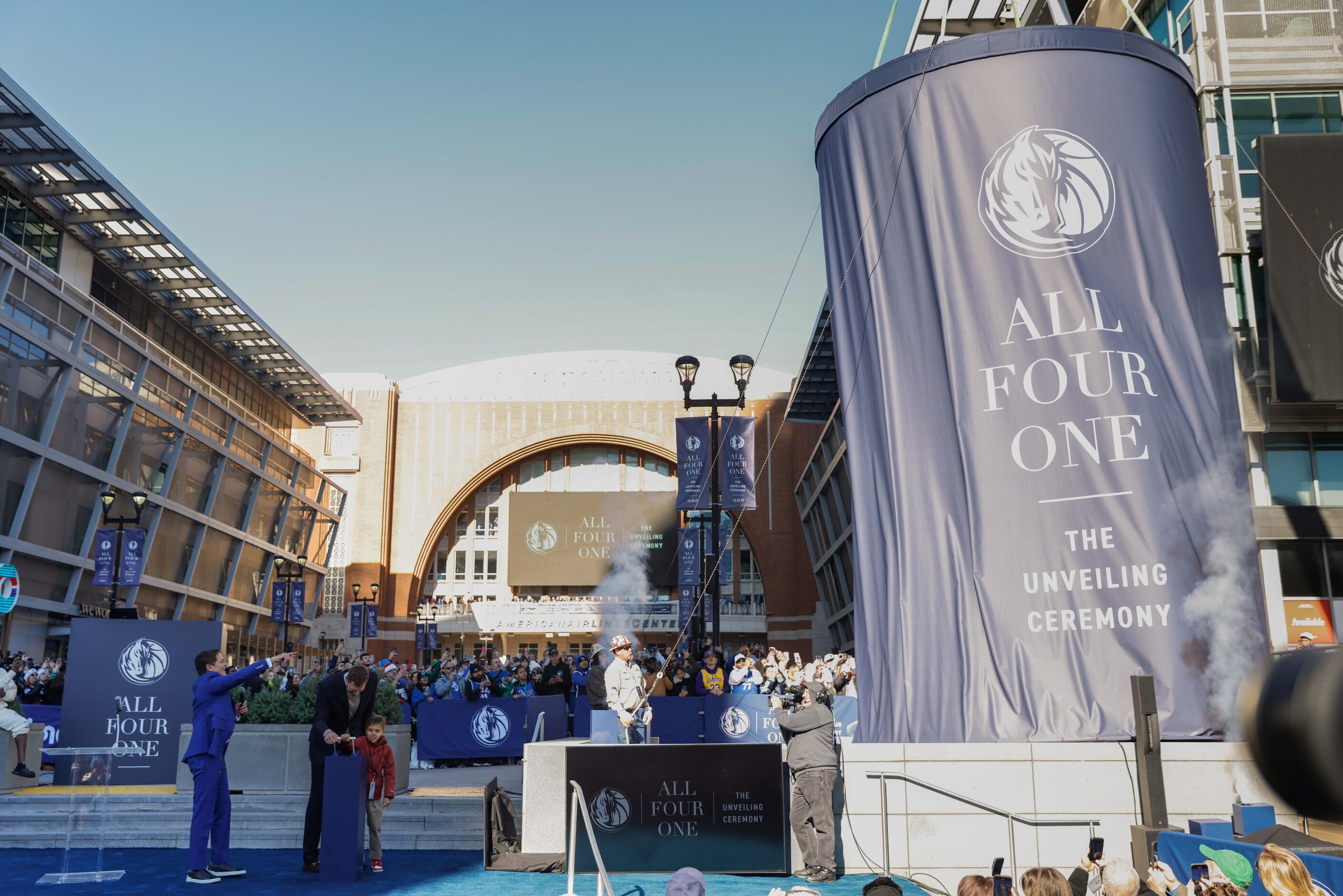 Mark Cuban, left, presents the Christmas Day unveiling of Dirk Nowitzki statue as Dirk...