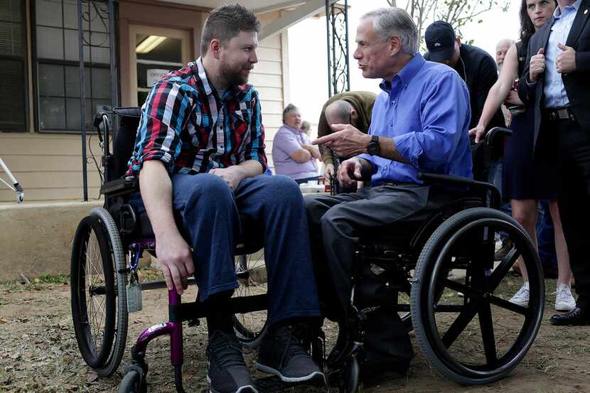Kris Workman, paralyzed in the shooting, talked with Gov. Greg Abbott during Remembering...