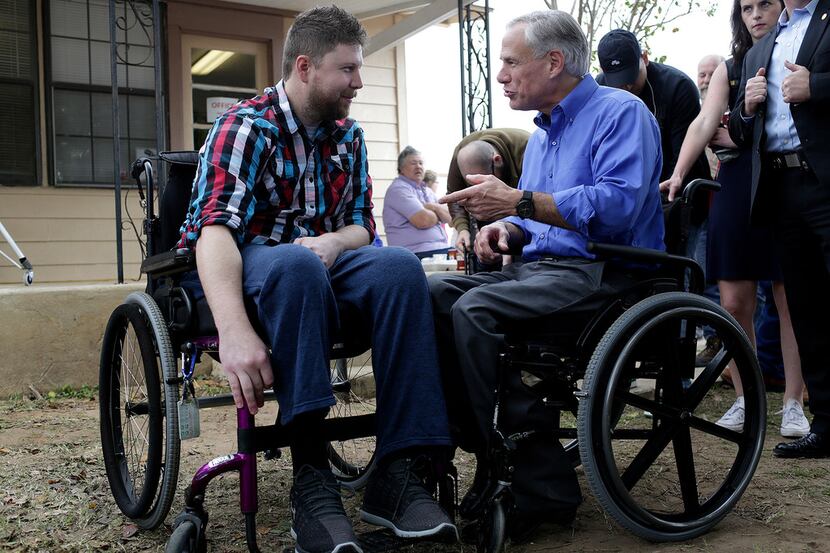 Kris Workman, paralyzed in the shooting, talked with Gov. Greg Abbott during Remembering...