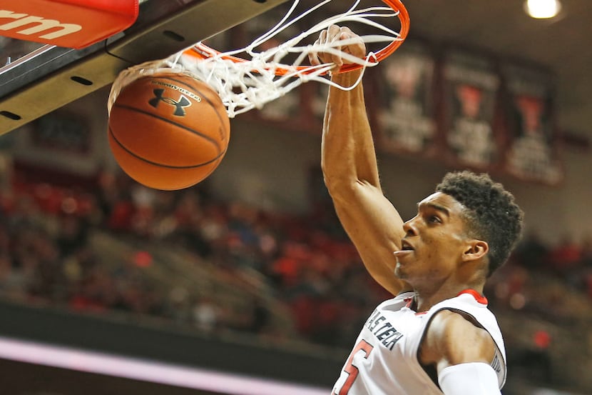 Texas Tech's Justin Gray dunks against Texas during an NCAA basketball game Wednesday, March...