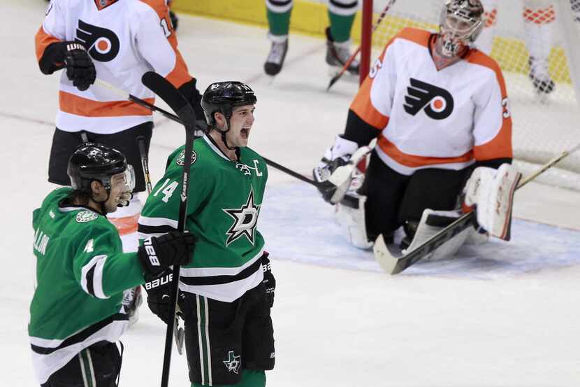 Dallas Stars left wing Jamie Benn (14) reacts to a goal made by Dallas Stars center Tyler...