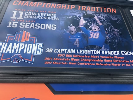 A sign on the window of the Vander Esch Express details the Boise State credentials of...