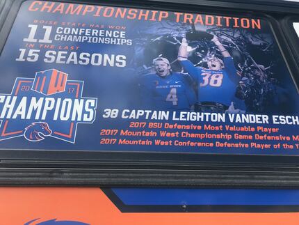 A sign on the window of the Vander Esch Express details the Boise State credentials of...