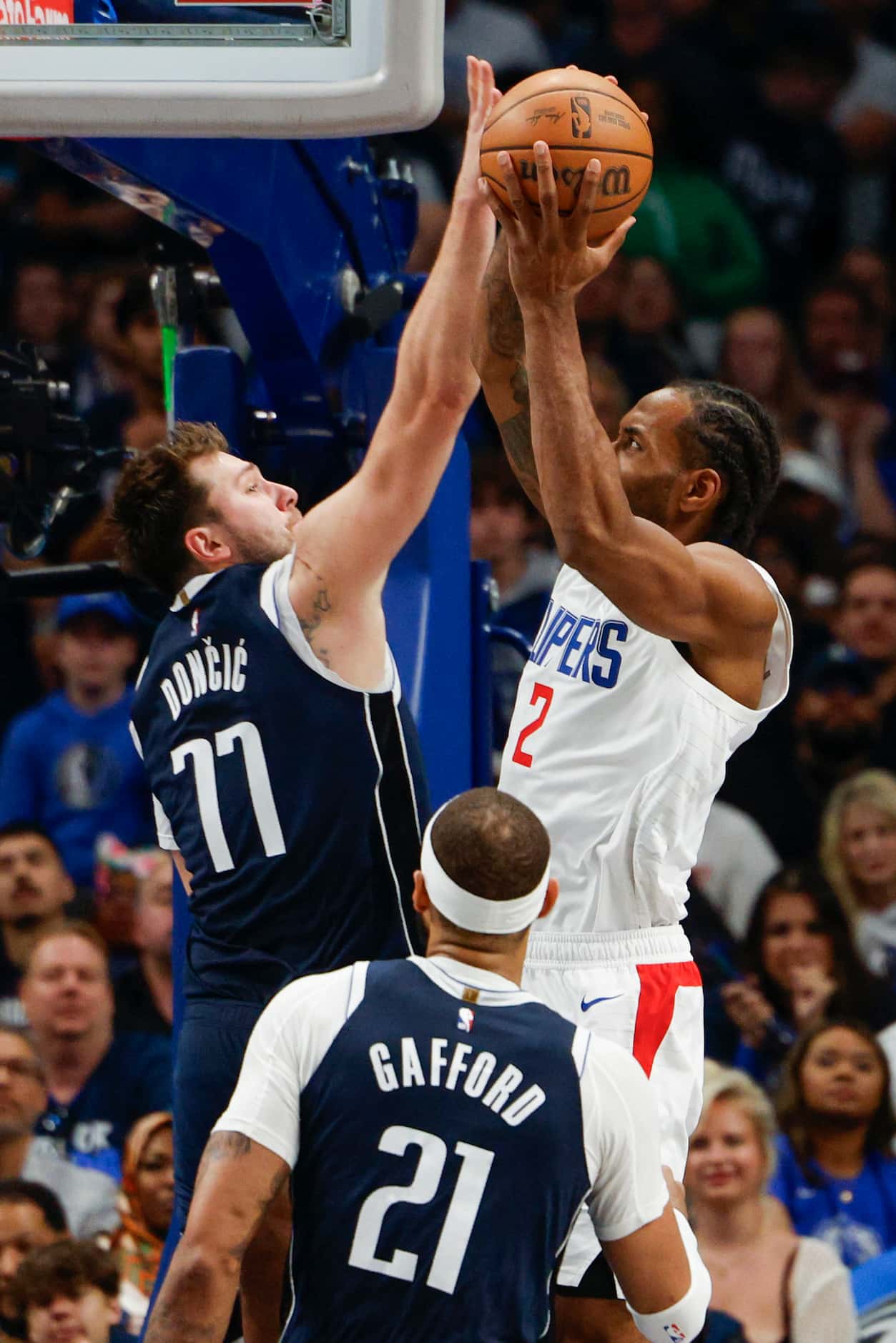 Dallas Mavericks guard Luka Doncic (77) contests a shot attempt from LA Clippers forward...