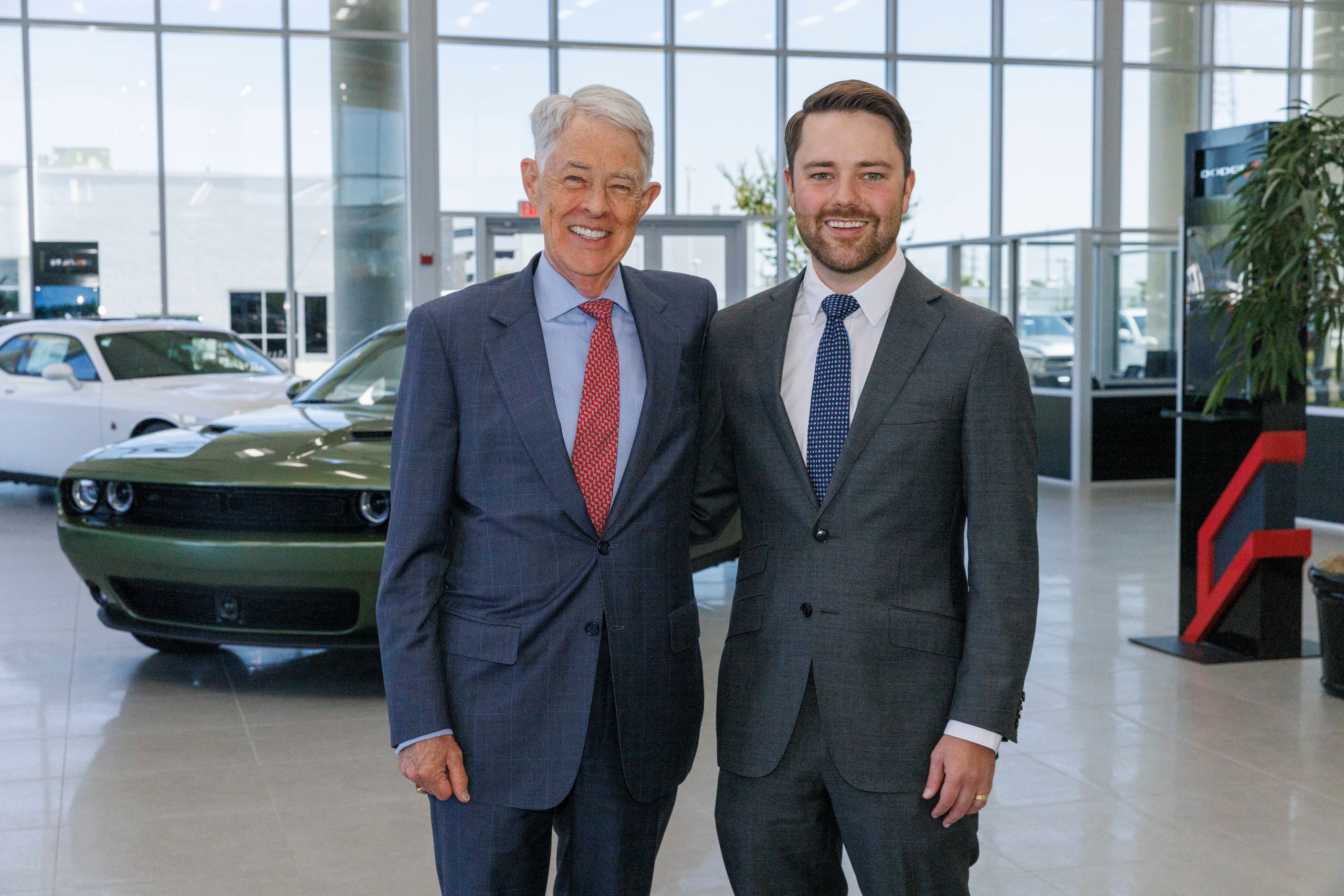 Owner Ray Huffines (left) with his son and general manager Sam Huffines at Huffines Chrysler...