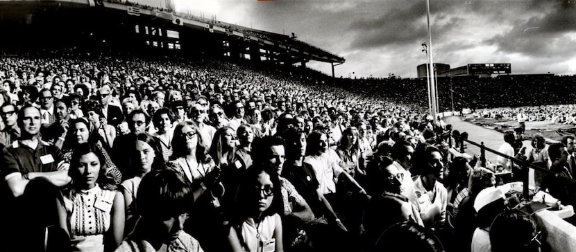 Explo '72 delegates jammed the Cotton Bowl stands and overflowed onto the turf Tuesday night...