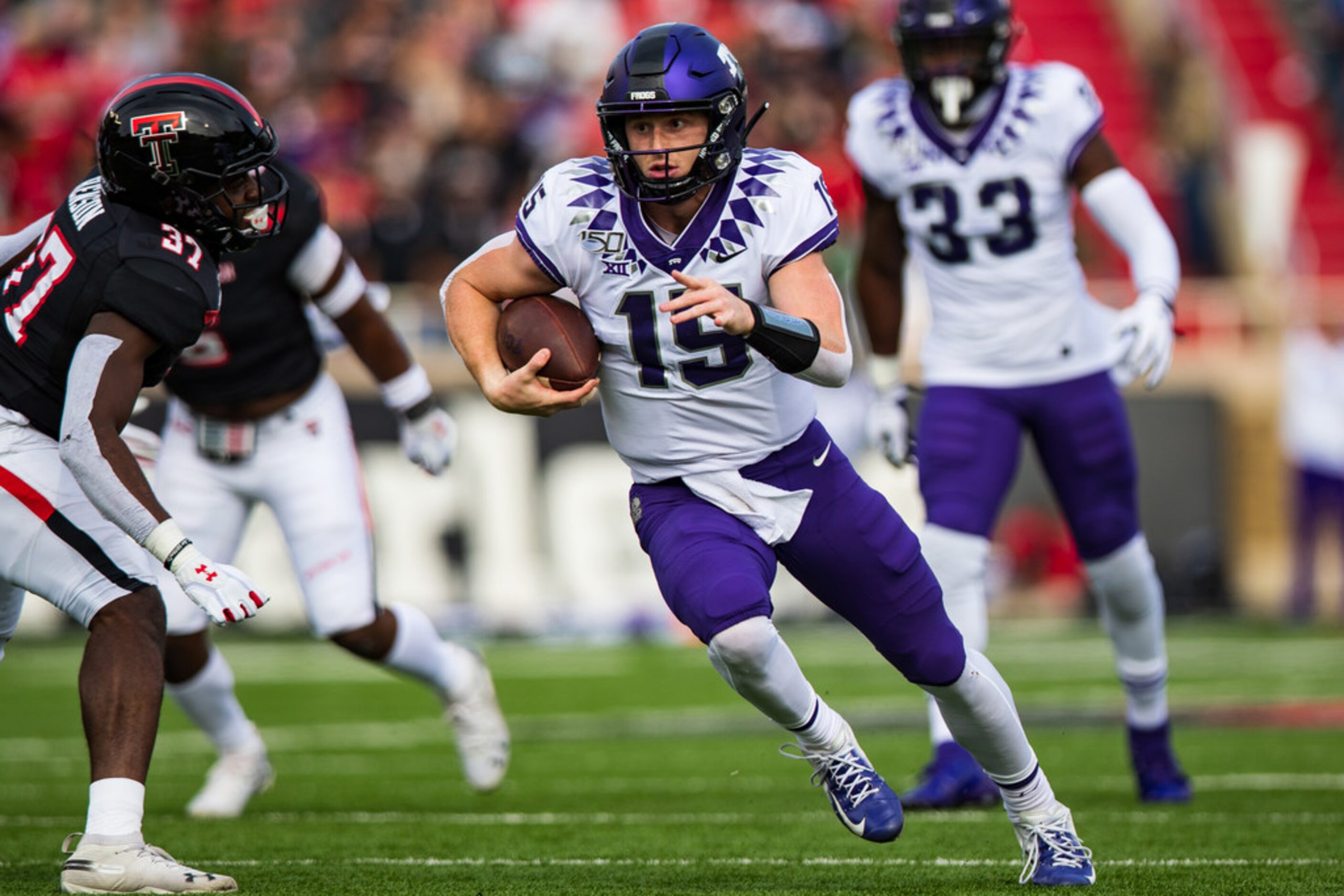 LUBBOCK, TEXAS - NOVEMBER 16: Quarterback Max Duggan #15 of the TCU Horned Frogs runs the...