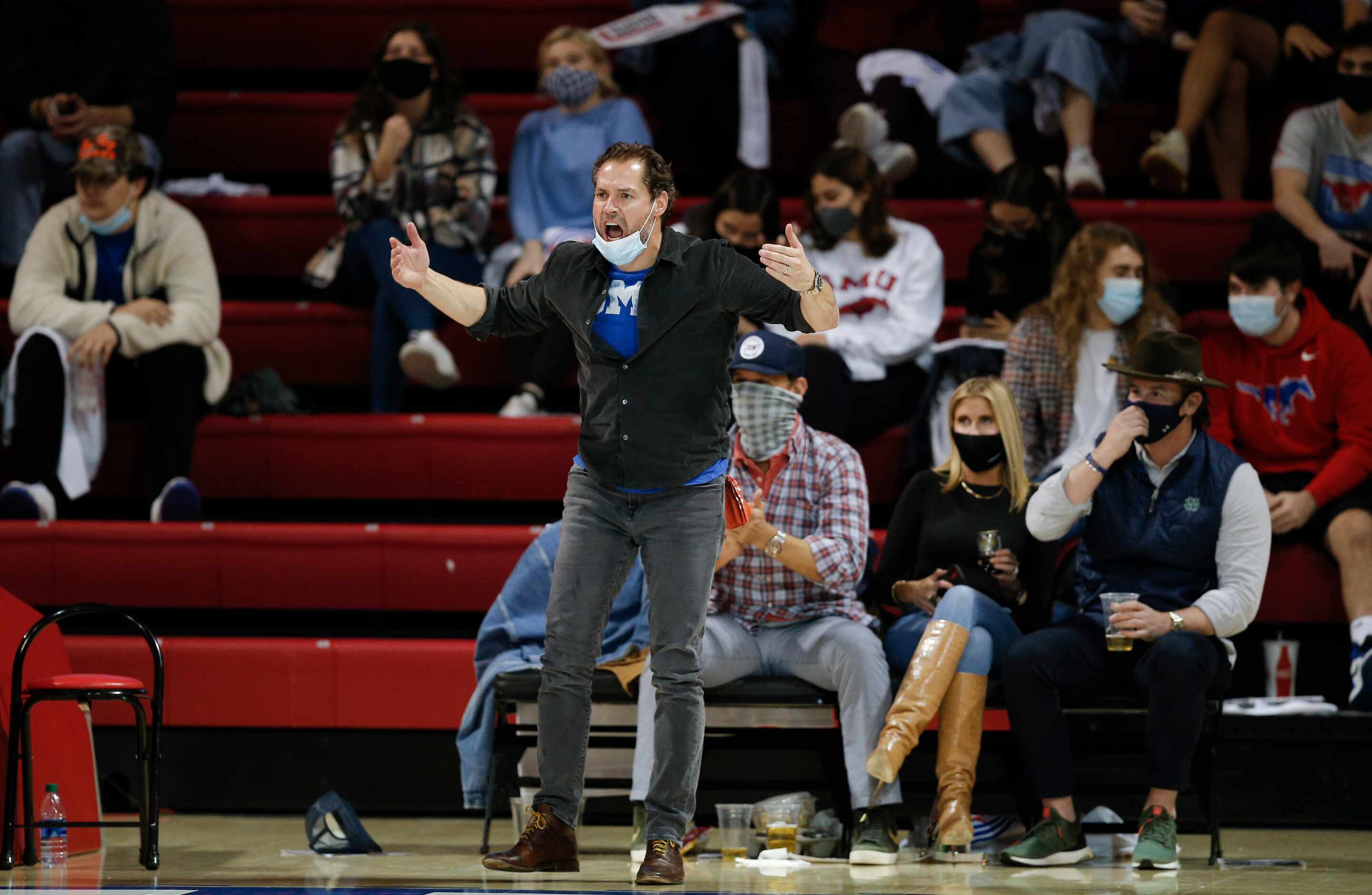 An SMU fan cheers on the team during the second half of a college basketball game against...