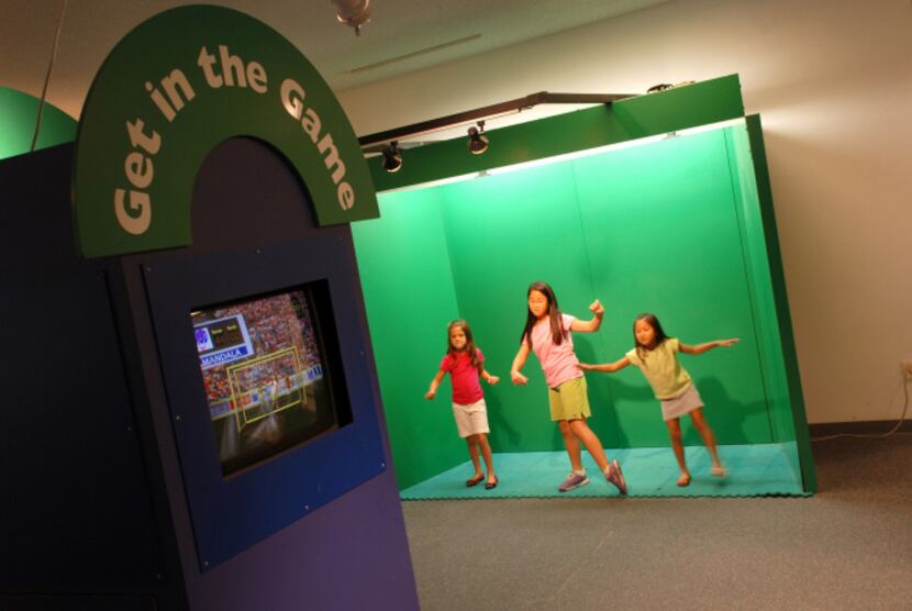 At the Discovery Center Museum, the "Get in the Game" exhibit lets visitors stand in front...
